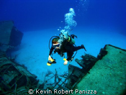 Wendy photographing a Sunken Destroyer in Cayman Brac.
C... by Kevin Robert Panizza 